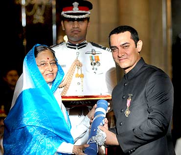 President presenting Padma Bhushan Bollywood star Aamir Khan