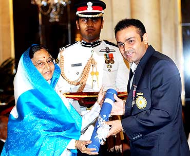 President presenting Padma Shri Award to cricket icon Virender Sehwag