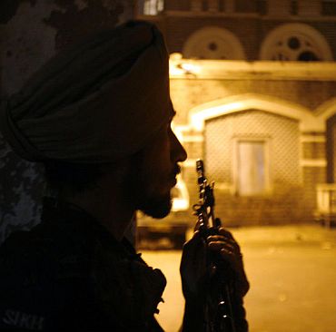 A paramilitary trooper keeps watch during the 26/11 attacks