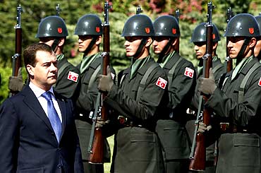 Russia's President Dmitry Medvedev reviews a honour guard at the presidential palace
