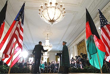 US President Barack Obama and Afghan President Hamid Karzai at a news conference in the East Room at the White House