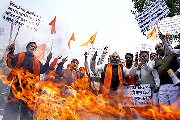 Shiv Sena activists shout slogans against Afzal Guru
