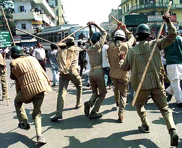 Police chase Rashtriya Janata Dal supporters in Patna, Bihar.