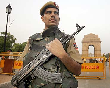 A policeman stands guard at India Gate in New Delhi.
