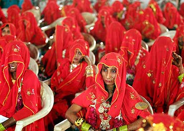 Muslim brides participate in a mass wedding ceremony in Ahmedabad