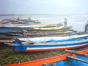 Fishermen anchor their boats in Visakhapatnam after the cyclone alert