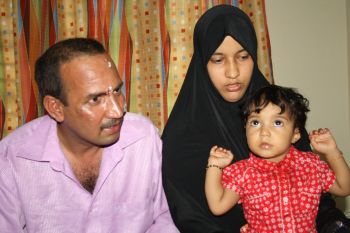 Abdullah Islamil with his wife and child at the hospital