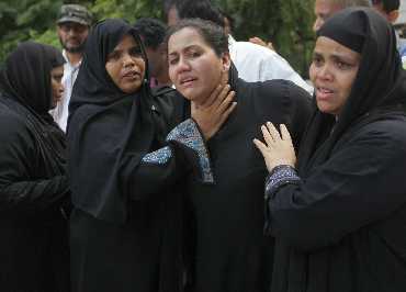Relatives of the victims of the plane crash mourn