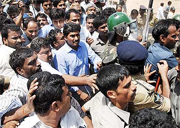 Jagan being taken away by the police