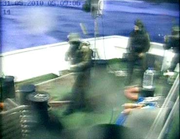 Israeli commandos are seen on a Gaza-bound ship in the Mediterranean Sea in this frame grab.