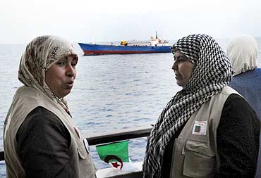 Activists chat on the Turkish ship Mavi Marmara, on its way to Gaza mission