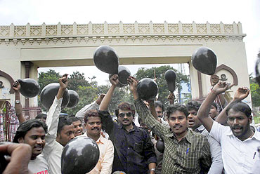 Protestors display black balloons of protest in Hyderabad