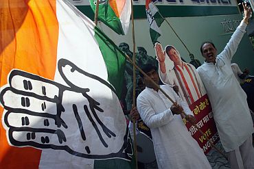Supporters celebrate the victory of Congress party-led alliance in Maharashtra