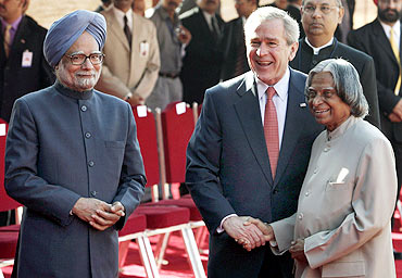 Then US President George W Bush with then President A P J Abdul Kalam and Dr Singh in New Delhi