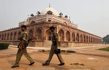 Indian security personnel keep watch inside the lawns of Humayun's Tomb in New Delhi