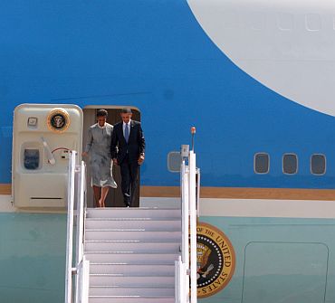 President Obama exits Air Force One with wife Michelle