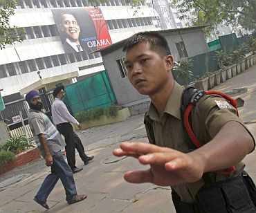 Security personnel stop the media outside the American Centre in New Delhi