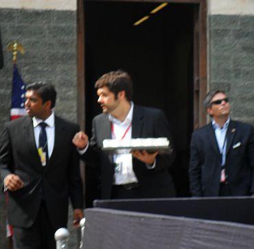 US consular staff with water for the students