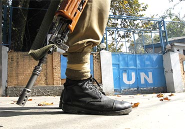 A  policeman guards the main gate of the United Nations Military Observer Group in Srinagar