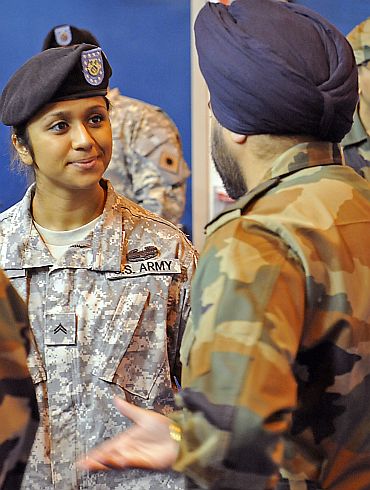 Balreet Kaur discusses her heritage with an Indian Army soldier before the opening ceremony for the combined training exercise Yudh Abhyas 2010