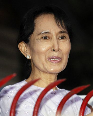 Aung San Suu Kyi speaks with supporters after she was released from house arrest in Yangon
