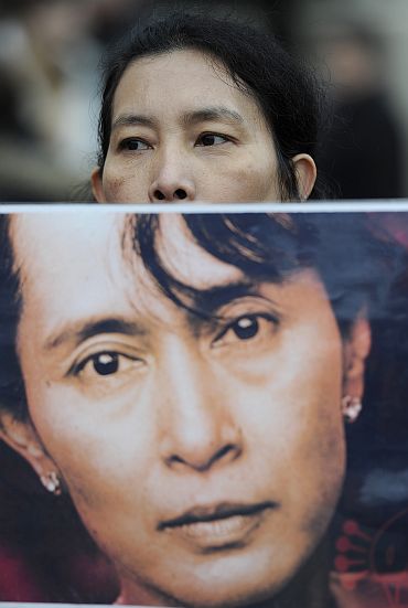 A supporter of Aung San Suu Kyi demonstrates in Trafalgar Square London