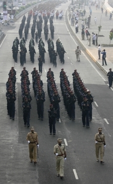 Platoons of Mumbai police conduct a march past near the seafront in Mumbai in memory of the 166 people killed in the 26/11 terror attack