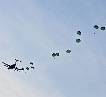 Soldiers from US Army Alaska and the Indian Army jump from a C-17 during the combined airborne jump that landed them at Malamute drop-zone Joint Base Elmendorf-Richardson