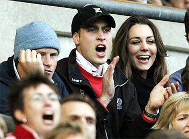 Prince Williams and Middleton cheer during a rugby match