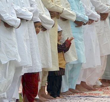 Muslims perform the Eid al-Adha prayers at the ruins of the Feroz Shah Kotla mosque in New Delhi