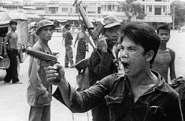 Soldiers of the Khmer Rouge regime threatening local Vietnamese