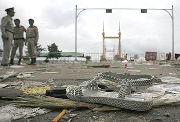 A woman's shoe is seen among the debris as police cordon off the bridge