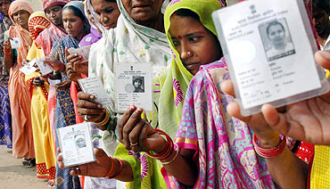 People line up to cast their votes during the Bihar polls
