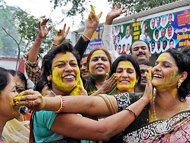 Janata Dal-United supporters celebrate their party's victory in Patna