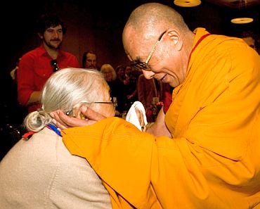 The Dalai Lama interacts with a devotee
