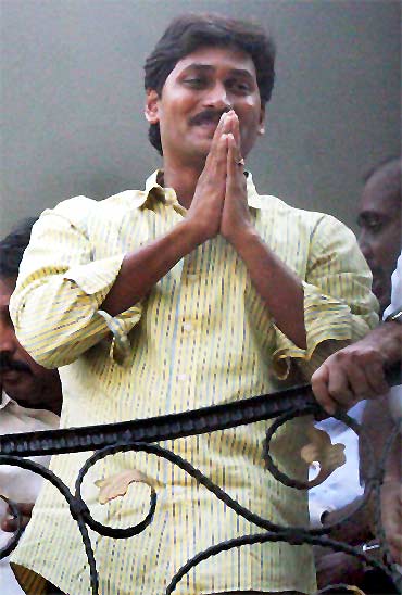 Jagan Reddy greets supporters after quitting Congress, at his Hyderabad residence on Monday