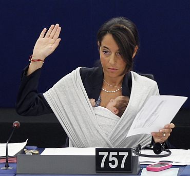 Italy's Member of the European Parliament Licia Ronzulli takes part with her baby in a voting session at the European Parliament in Strasbourg on September 22