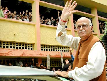 Advani waves as he comes out of a district court in Rae Bareli in July, 2005