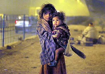 Homeless children under a flyover in New Delhi