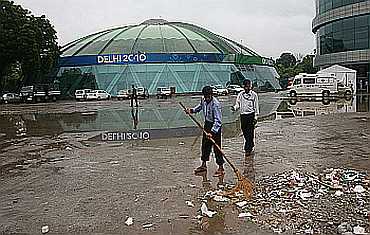 Sweepers cleaning a CWG venue