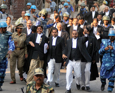 Paramilitary troopers escort lawyers for the Ayodhya case litigants in Lucknow