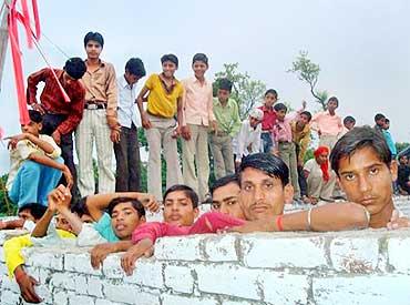 Villagers watch the foundation laying ceremony in Bankagoan, UP