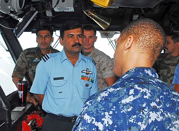 Members of the Indian armed forces tour the bridge of the amphibious assault ship USS Essex (LHD 2) as part of exercise Habu Nag