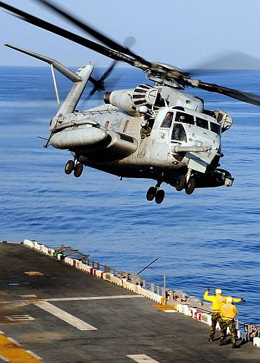 A CH-53E Sea Stallion helicopter assigned to Marine Medium Helicopter Squadron (HMM) 262, takes off