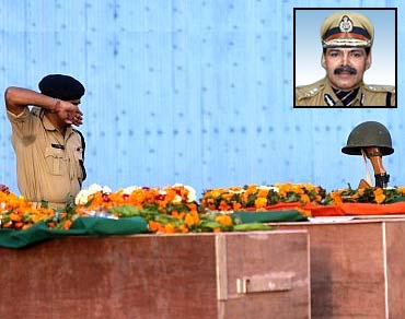 CRPF jawan pays his last respects to colleagues who died in a Naxalite attack in Chhattisgarh. Inset:K Vijay Kumar