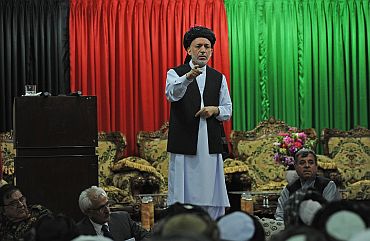 Afghan President Hamid Karzai speaks at a meeting with tribal leaders in Kandahar