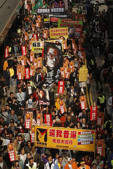 Protesters take to the streets in a march in support of jailed Chinese dissident Liu Xiao Bo, in Hong Kong on January 1