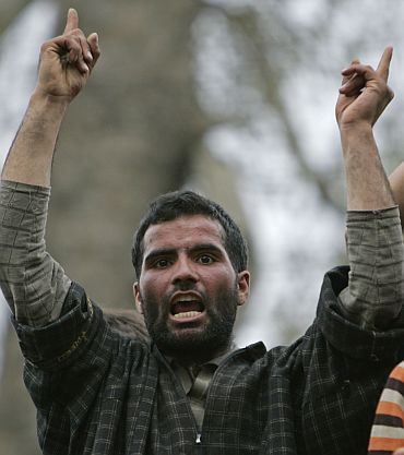 A Kashmiri protester shouts pro-freedom slogans during the funeral of two militants after a gun battle between army and rebels near Srinagar
