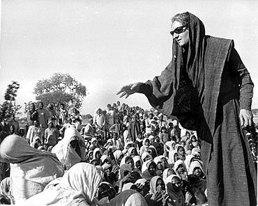 Indira Gandhi speaks to villagers during a political rally