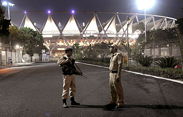 Policemen stand guard outside the Jawaharlal Nehru Stadium